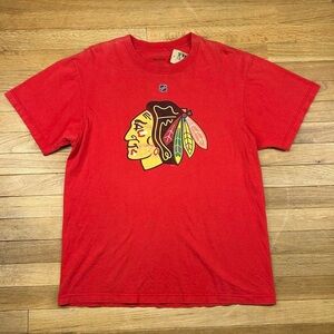 Faded red Chicago NHL Blackhawks hockey t shirt.